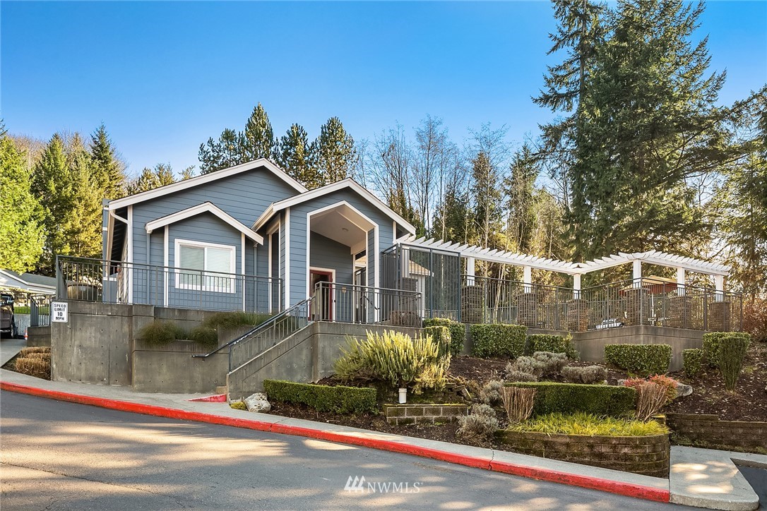 3926 243rd Place Southeast, Unit H301 Bothell, WA 98021 - Photo 14 of 16 a front view of a house with garden