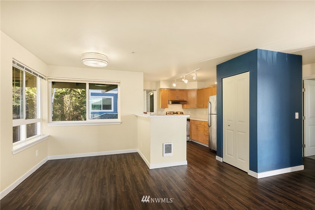 3926 243rd Place Southeast, Unit H301 Bothell, WA 98021 - Photo 4 of 16 a view of a kitchen with wooden floor and a window