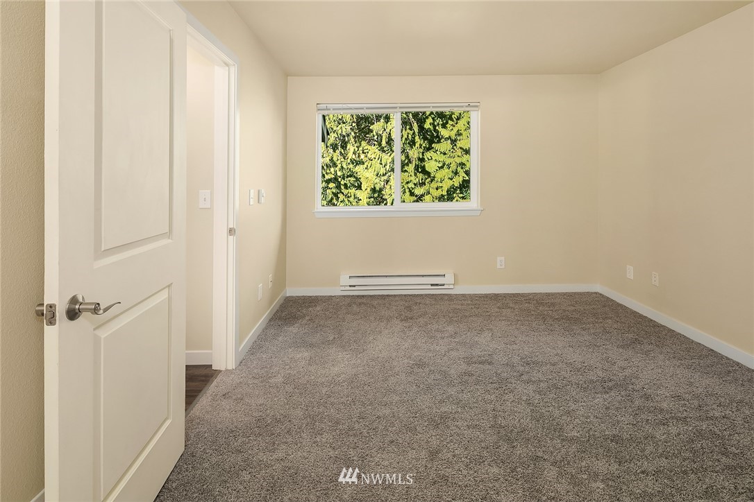 3926 243rd Place Southeast, Unit H301 Bothell, WA 98021 - Photo 6 of 16 an empty room with windows