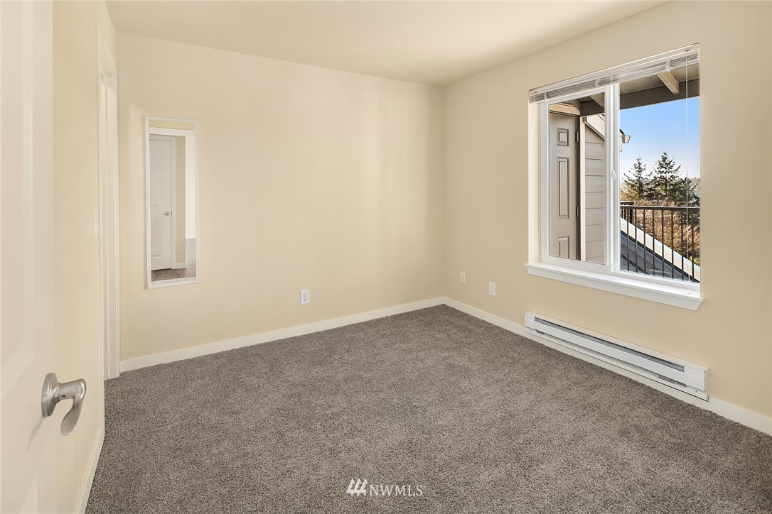 3926 243rd Place Southeast, Unit H301 Bothell, WA 98021 - Photo 9 of 16 an empty room with windows and closet