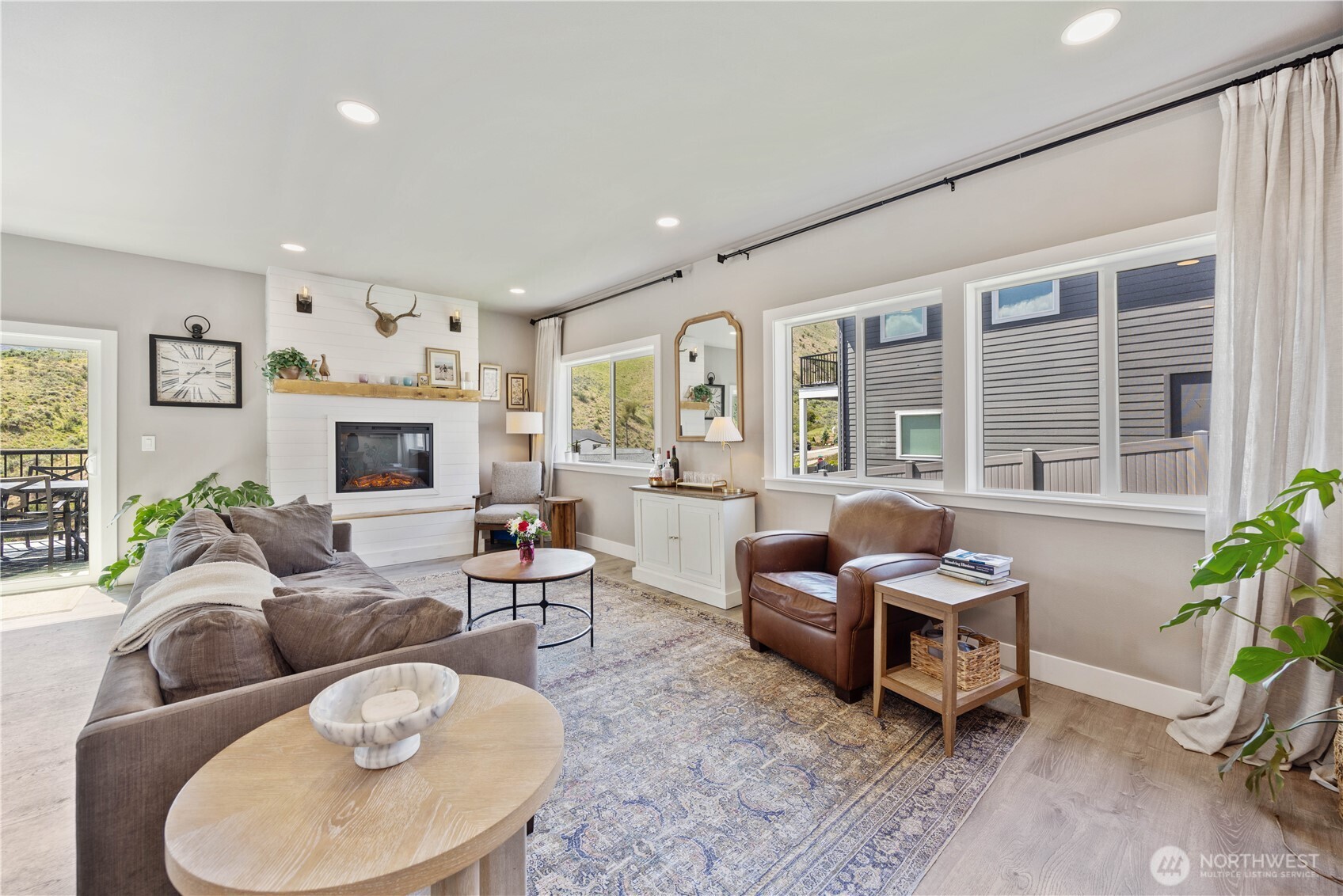 9968 Griffith Place Entiat, WA 98822 - Photo 12 of 38 a living room with furniture and a fireplace