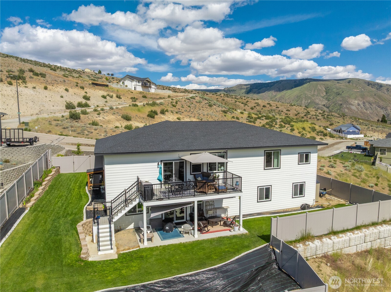 9968 Griffith Place Entiat, WA 98822 - Photo 34 of 38 a view of a house with a yard porch and sitting area