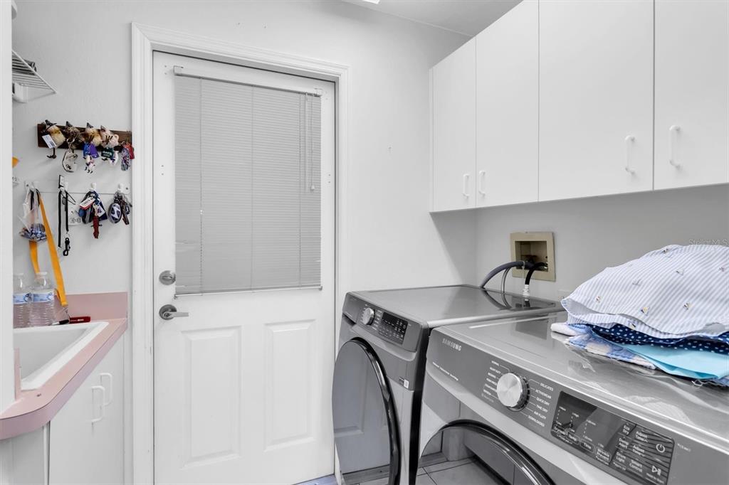 9052 Arundle Place New Port Richey, FL 34655 - Photo 21 of 57 a kitchen with a sink appliances and cabinets