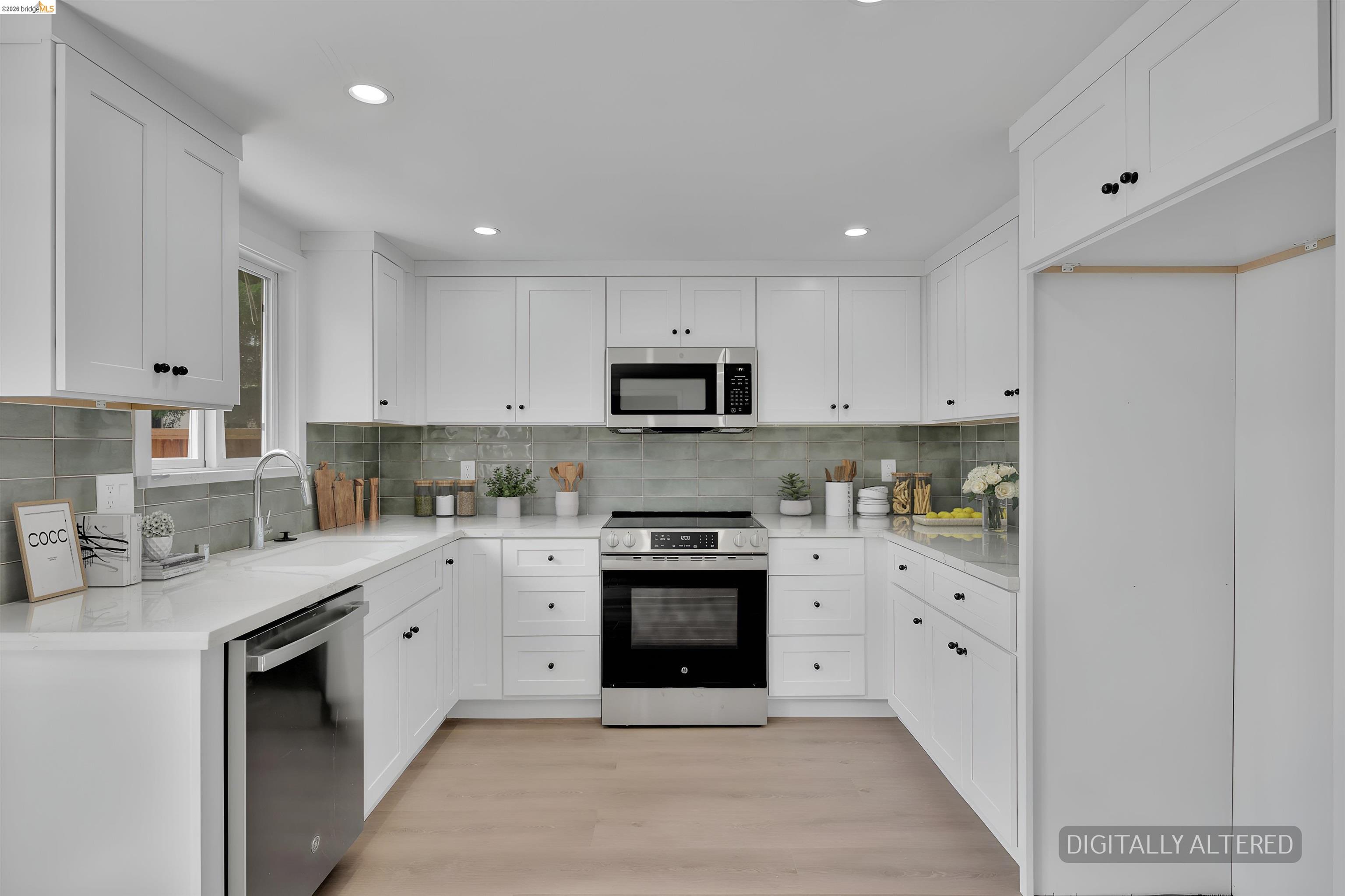 1808 Wildbrook Court, Unit D Concord, CA 94521 - Photo 11 of 47 a kitchen with stainless steel appliances granite countertop a stove a sink and a microwave