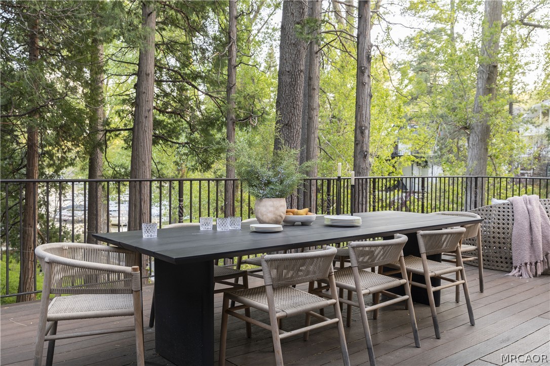 27643 West Shore Road, Unit 2 Lake Arrowhead, CA 92352 - Photo 9 of 28 a view of a table and chairs in the patio