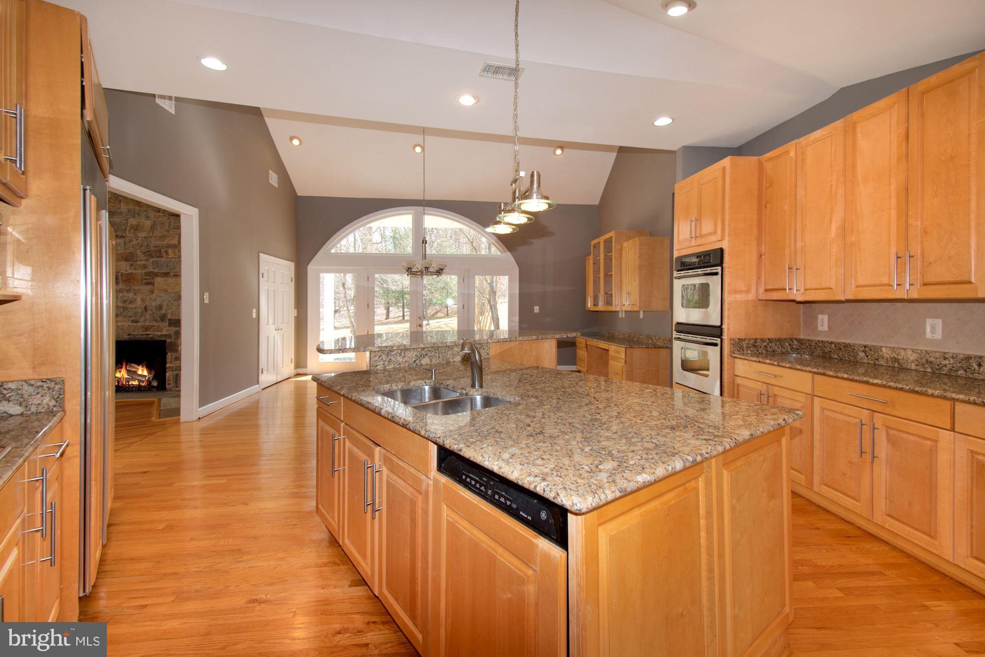 11261 South Glen Road Potomac, MD 20854 - Photo 12 of 55 Island with Sink & Pendant Lighting