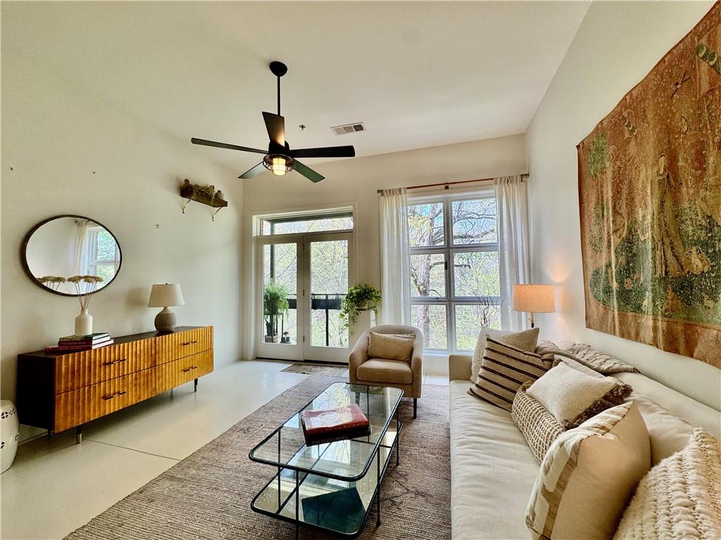 560 Dutch Valley Road Northeast, Unit 2414 Atlanta, GA 30324 - Photo 1 of 1 a living room with furniture and a window