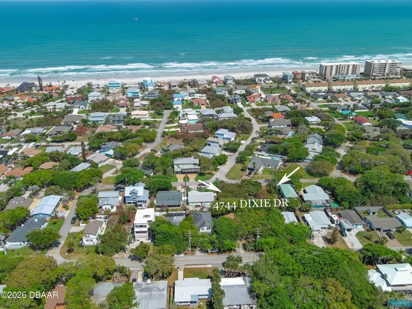 an aerial view of a house with outdoor space