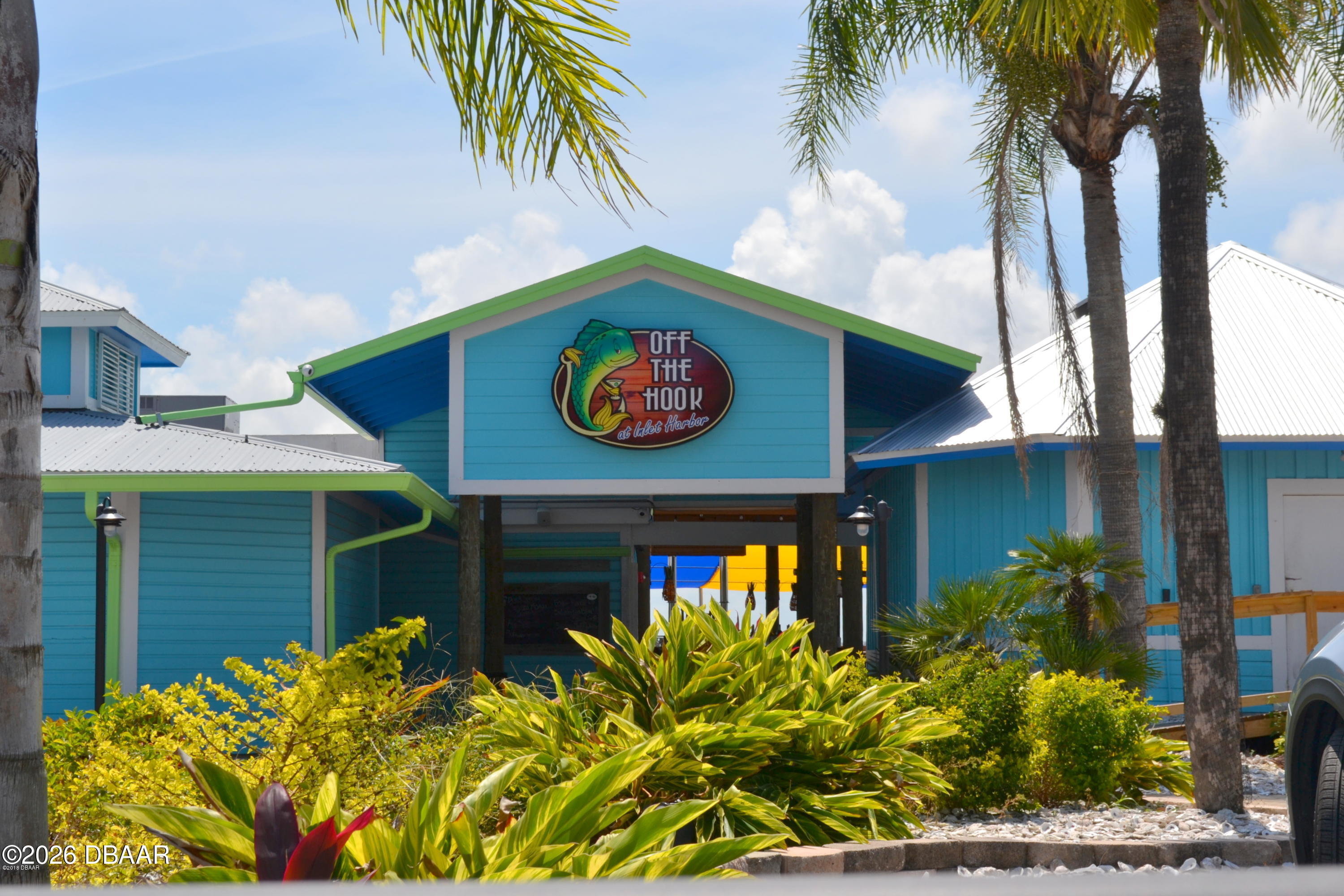 4744 Dixie Drive Ponce Inlet, FL 32127 - Photo 9 of 15 a sign that is on the side of a building