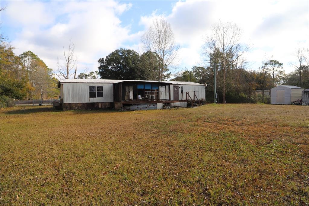 1332 Otis Road Jacksonville, FL 32220 - Photo 4 of 10 a view of a house with yard and sitting area
