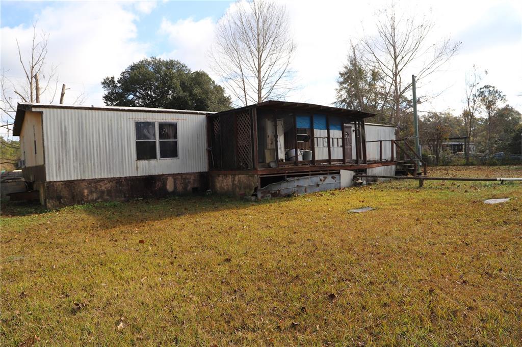 1332 Otis Road Jacksonville, FL 32220 - Photo 5 of 10 a front view of a house with a yard