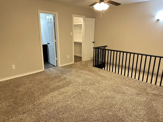 a bathroom with a granite countertop toilet a sink and bathtub