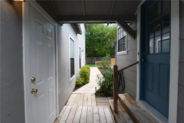 a view of a porch with wooden floor and outdoor space