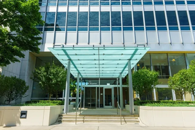 a view of a building with a backyard