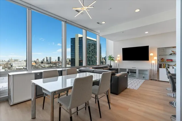a view of a dining room with furniture window and wooden floor