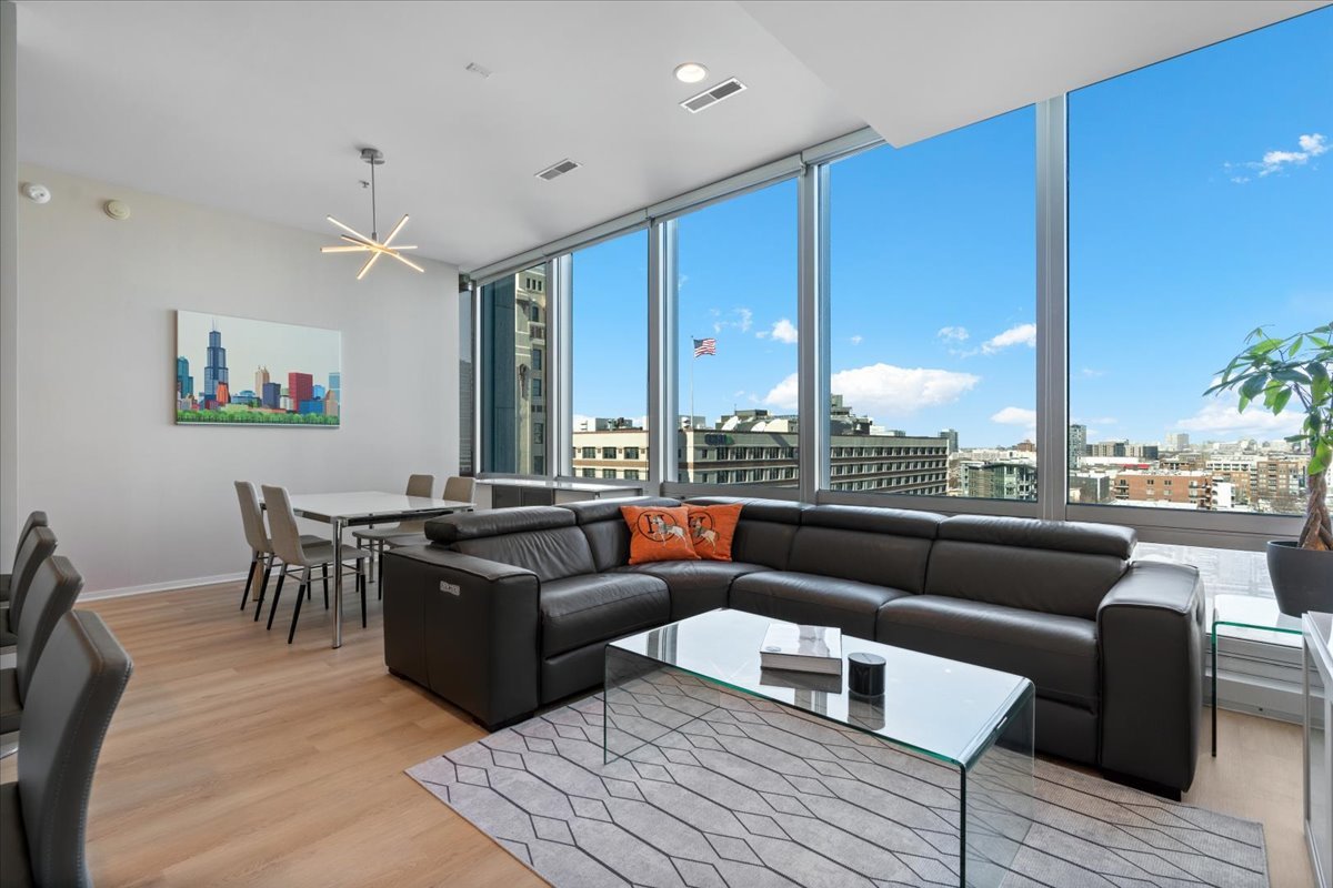 500 West Superior Street, Unit 802 Chicago, IL 60654 - Photo 9 of 28 a living room with furniture city view and large windows