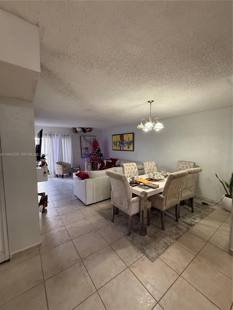 1950 West 54th Street, Unit 409 Hialeah, FL 33012 - Photo 7 of 26 a view of a livingroom and dining room