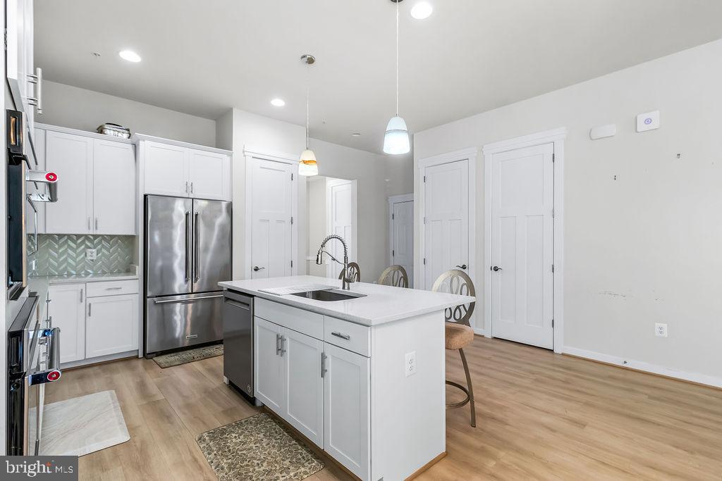 2806 Water Strider Way Odenton, MD 21113 - Photo 10 of 63 Granite island and with with pendant lights