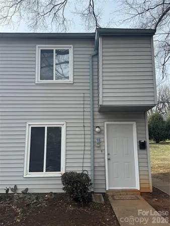 a front view of a house with a garage