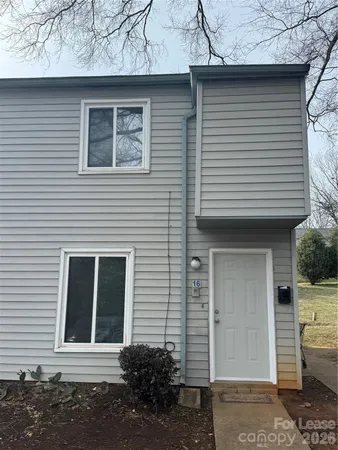a front view of a house with garage