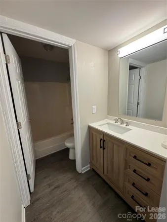 a bathroom with a double vanity sink and mirror