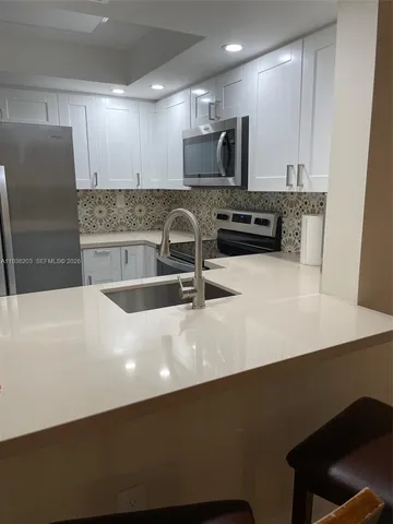 an empty room with windows and entrance