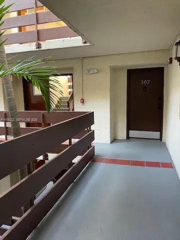 a room with furniture and a flat screen tv