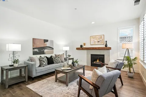 a white toilet sitting next to a bath tub