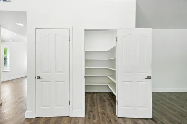 a bathroom with a bathtub and a window