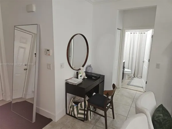 a view of a livingroom with furniture and entryway