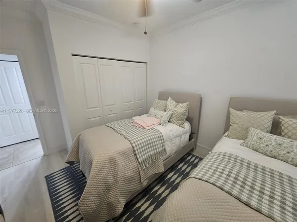 a bedroom with a bed and a walk in closet