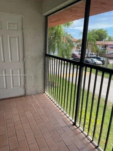 a kitchen with a refrigerator and a stove top oven