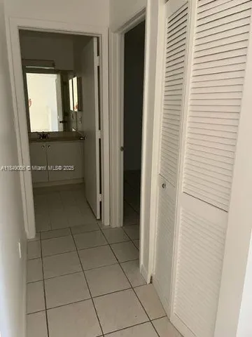 a room with a mirror and a sink