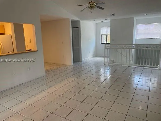a view of an empty room and a window