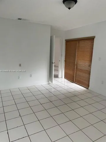 a bathroom with a toilet and a bathtub