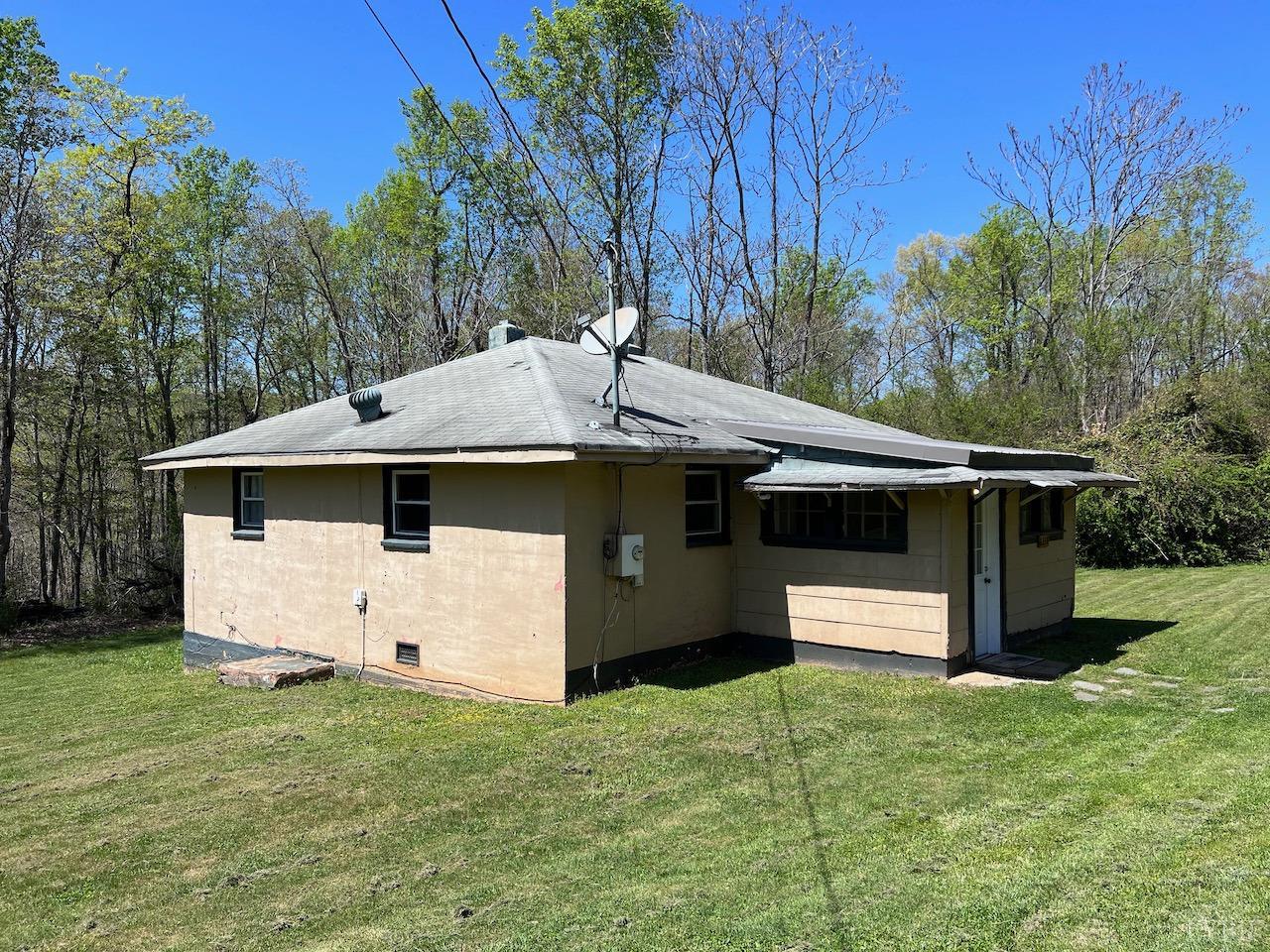 6238 Laurel Road Shipman, VA 22971 - Photo 8 of 11 a view of a white house with a yard