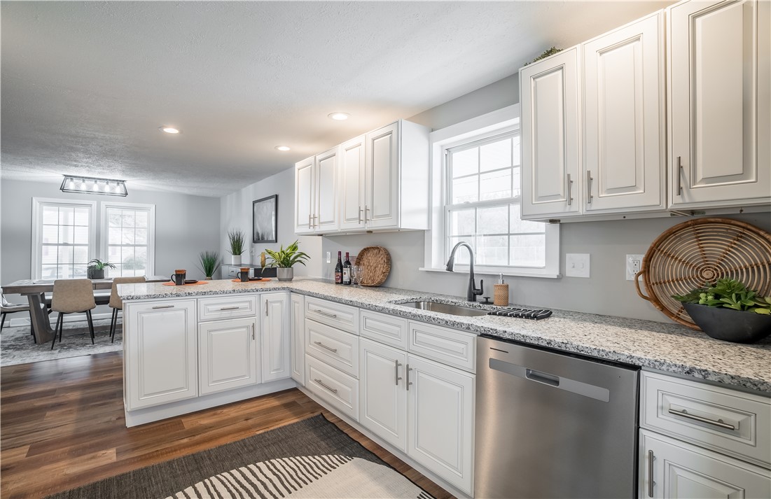8240 Looney Road Piqua, OH 45356 - Photo 13 of 49 This bright kitchen features ample counter space and connects to a spacious dining area.