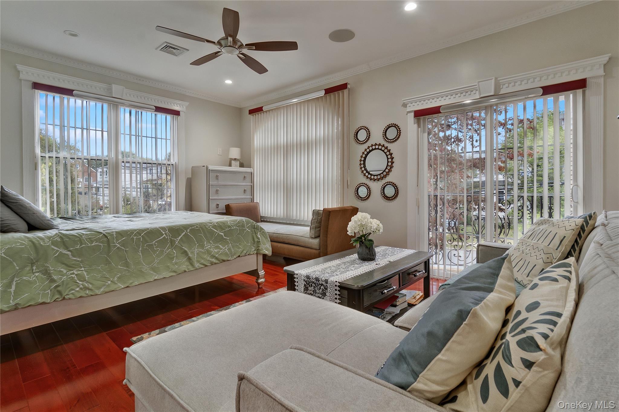193-19 109th Road Queens, NY 11412 - Photo 19 of 27 a living room with furniture and a floor to ceiling window