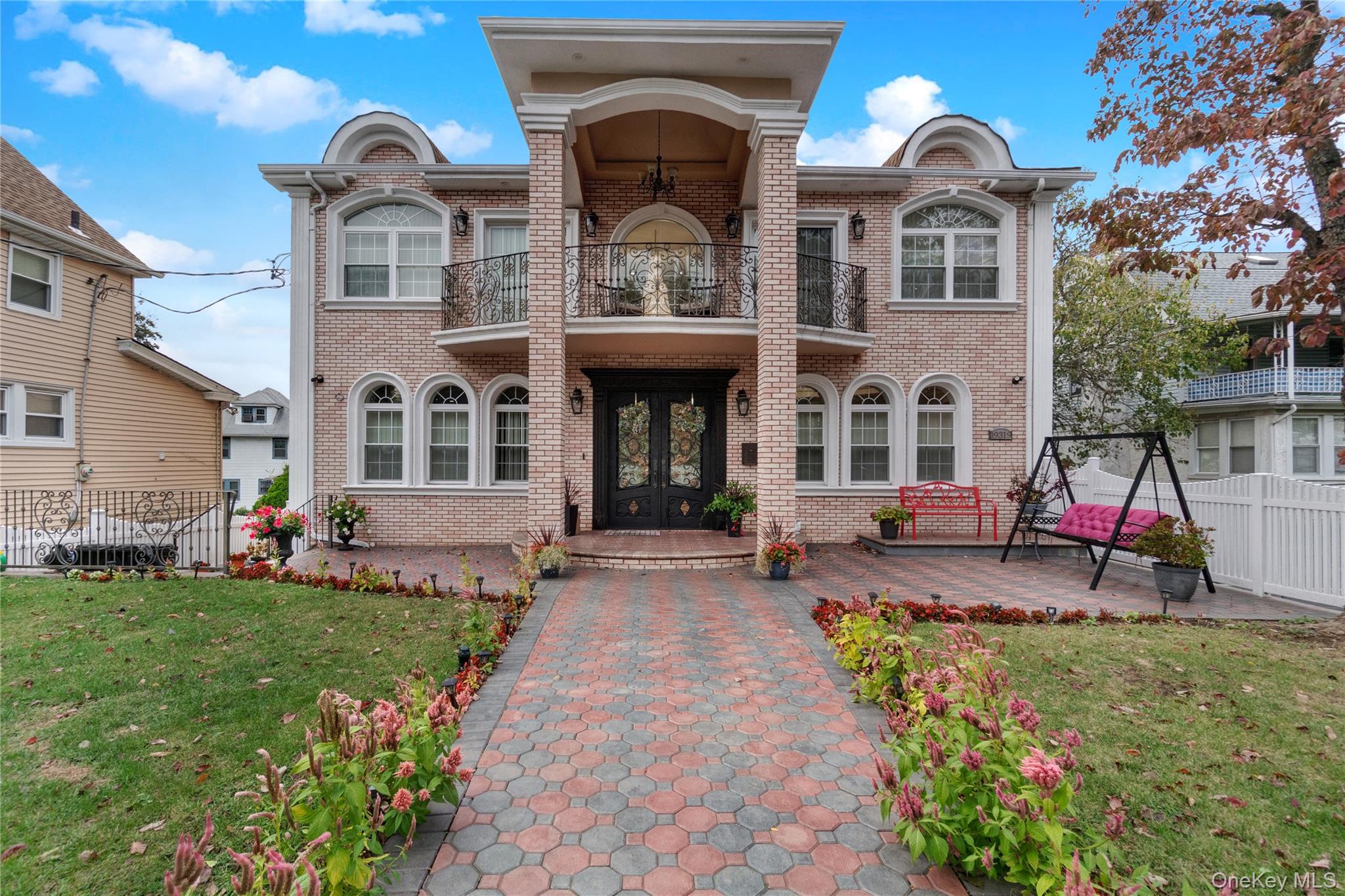 193-19 109th Road Queens, NY 11412 - Photo 2 of 27 a front view of a house with garden