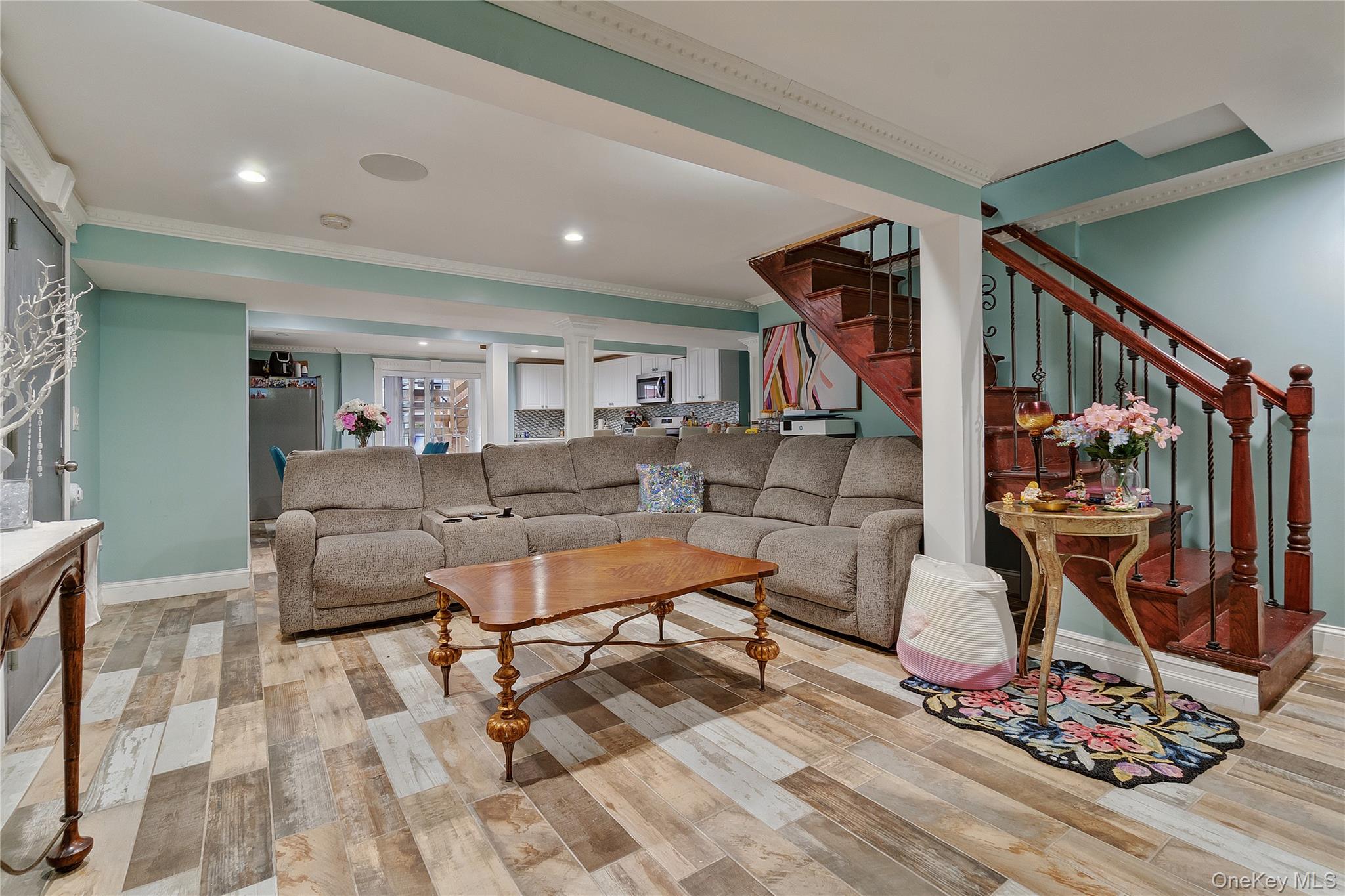 193-19 109th Road Queens, NY 11412 - Photo 24 of 27 a living room with furniture and gym equipment