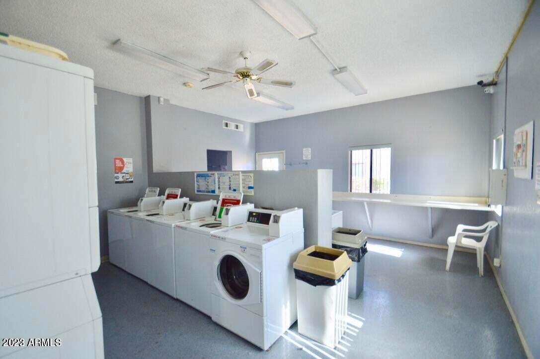 1440 North Idaho Road, Unit 1036 Apache Junction, AZ 85119 - Photo 11 of 13 a living room with furniture and white walls