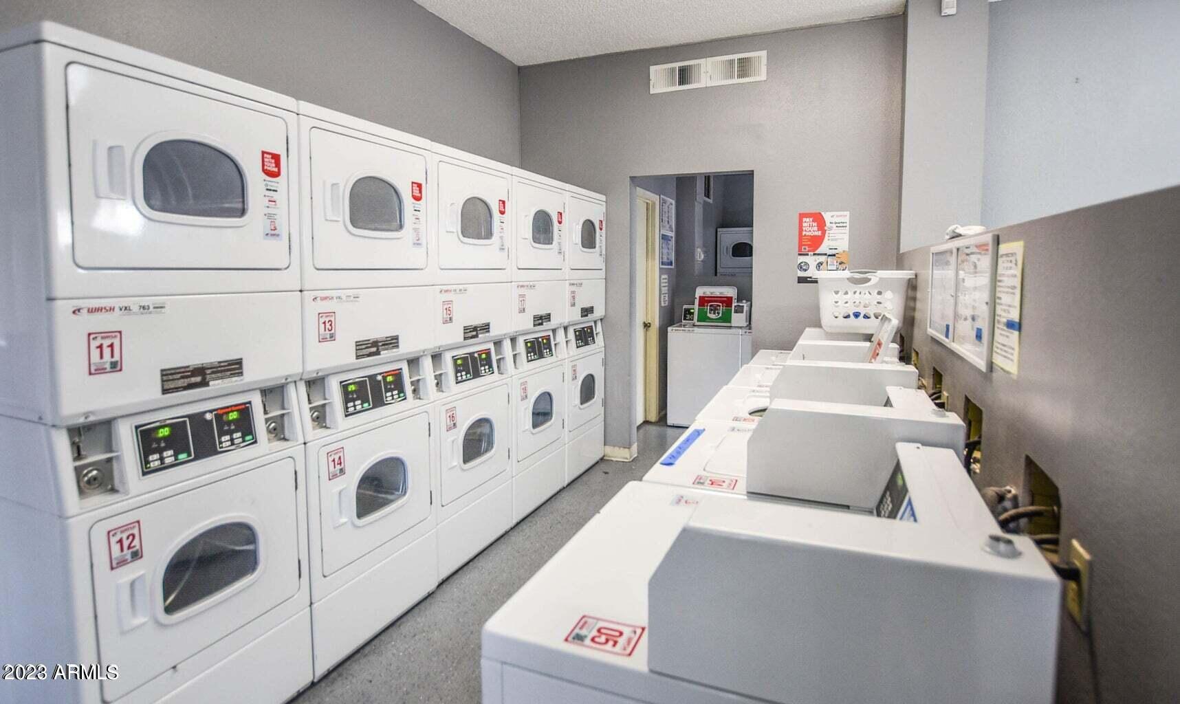 1440 North Idaho Road, Unit 1036 Apache Junction, AZ 85119 - Photo 12 of 13 a utility room with dryer and washer
