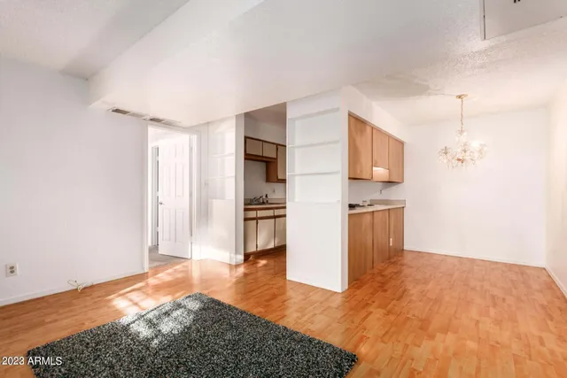 a view of kitchen with furniture and wooden floor