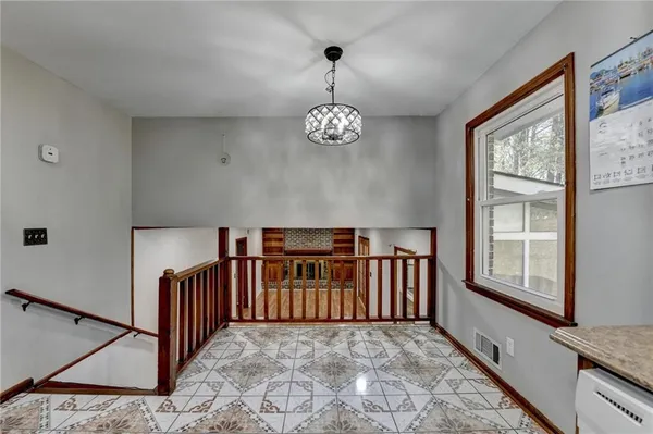 a view of a hallway with windows