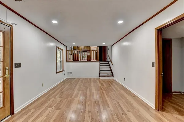 a view of entryway with wooden floor