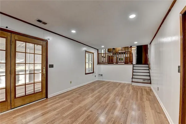 a view of a hallway with stairs