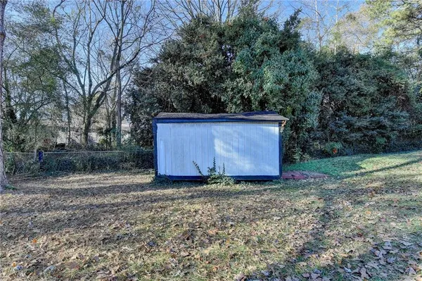 a view of a barn with big yard