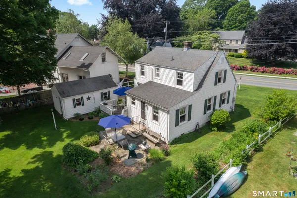 an aerial view of a house with a yard