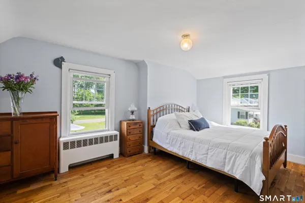 a bedroom with a bed and window