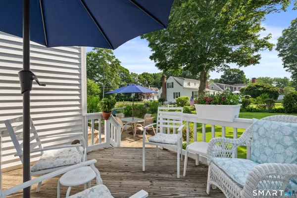 a view of a chairs and table in the patio